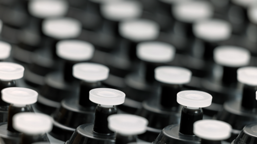 Side view of a box filled with numerous i3 TRrackPor M monitors