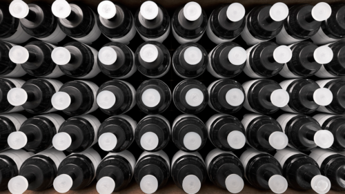 Top view of a box filled with numerous i3 TRrackPor M monitors