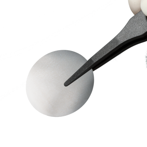 A aluminum-coated membrane held by a pair of tweezers